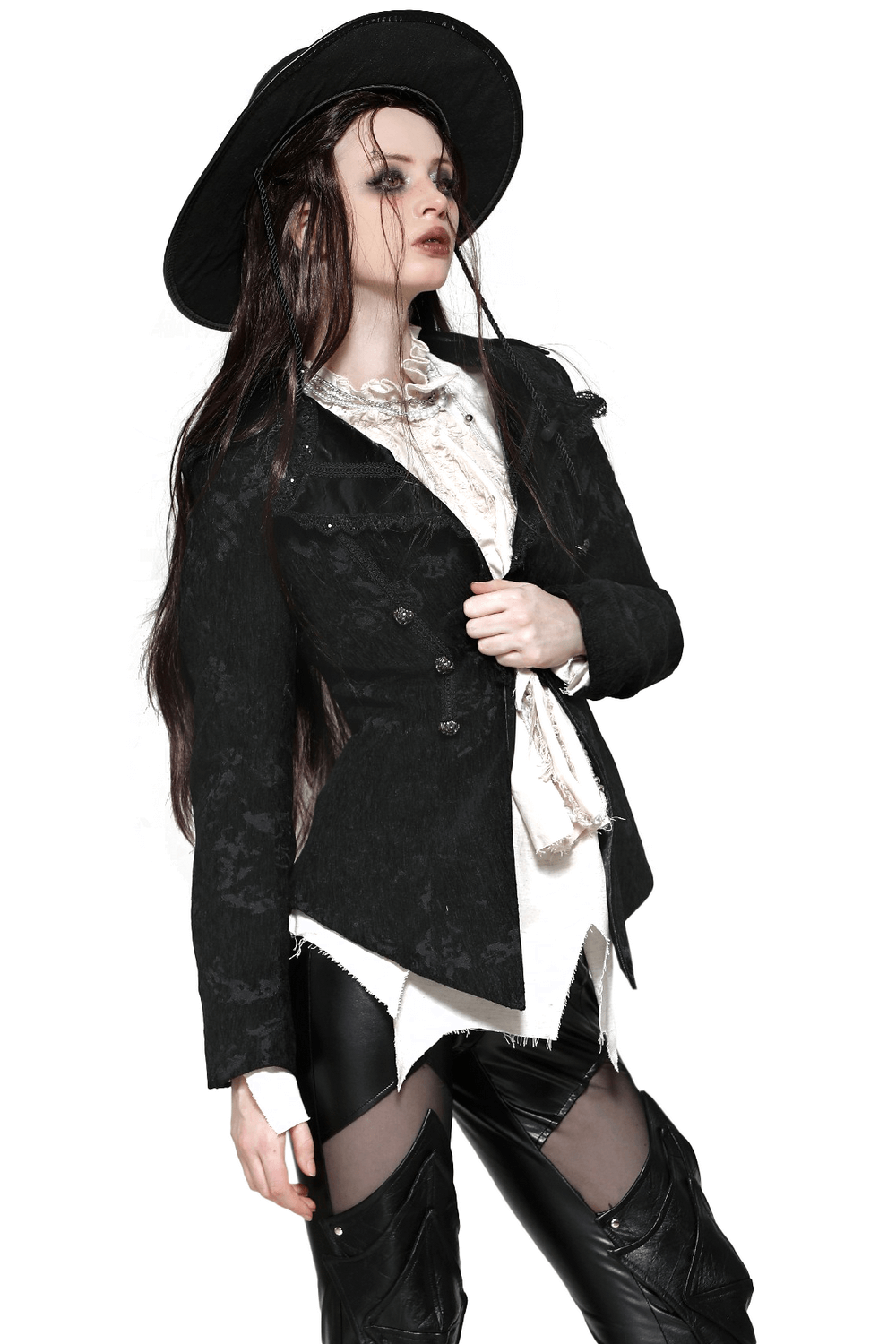 Model showcasing a gothic jacket with lace details, statement buttons, and a dramatic silhouette, paired with a stylish hat.