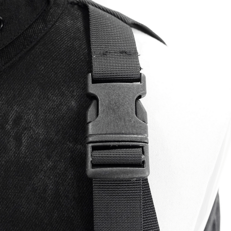 Close-up of buckle detail on a black gothic women's jacket, showcasing stylish strap design.