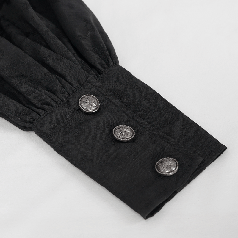 Close-up of Gothic Jacquard black shirt cuff with three ornate silver buttons.