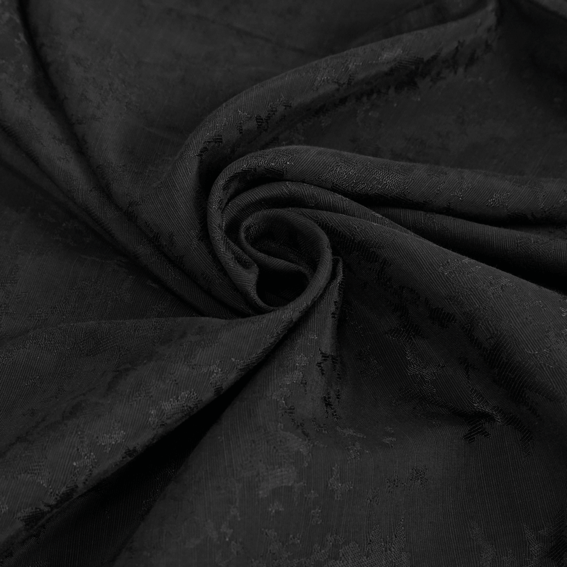 Close-up of intricate black jacquard fabric, perfect for gothic vintage clothing designs.