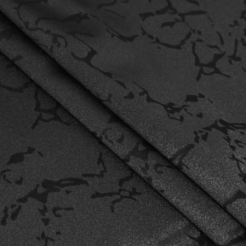 Close-up of luxurious black jacquard fabric, perfect for gothic bowties and elegant male accessories.