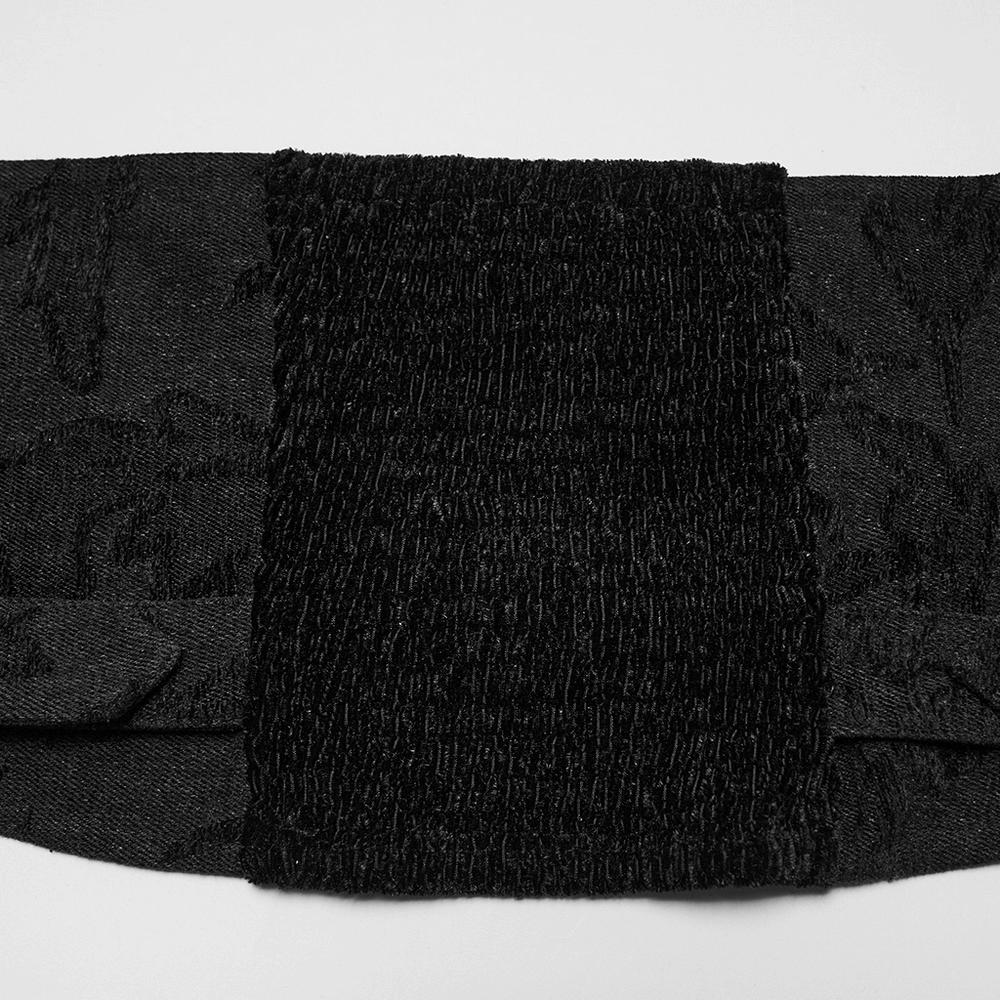 Gothic jacquard denim vest detail showcasing black fabric with textured detachable fur collar.