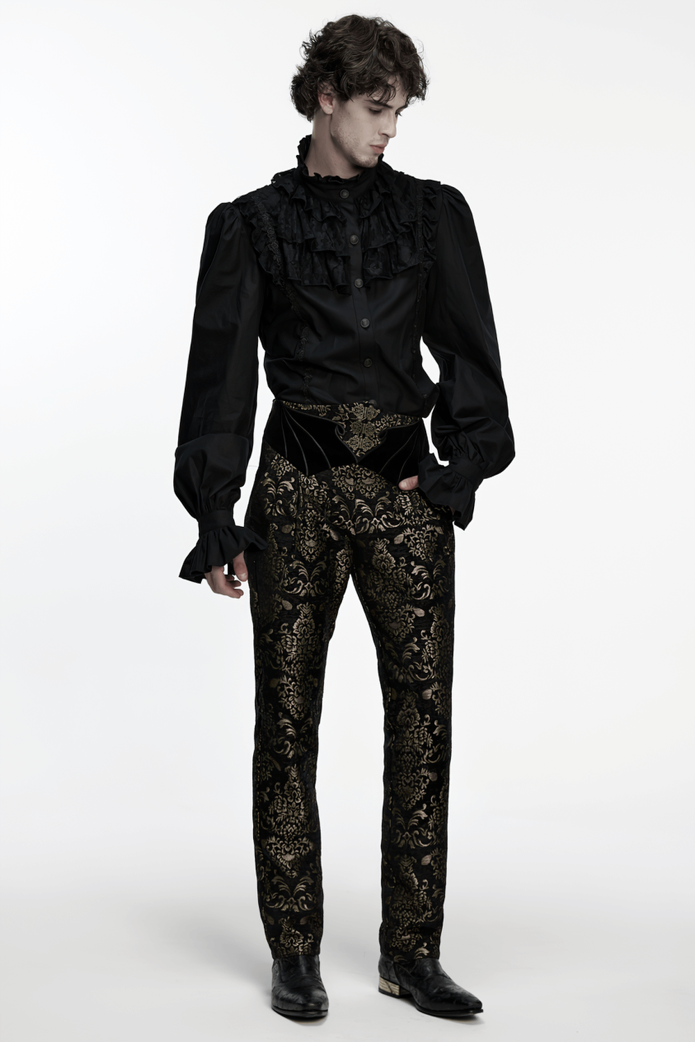 Gothic Jacquard Embroidered Black Pants with Gold Patterns worn by a model, featuring intricate gold embroidery and a stylish black shirt.