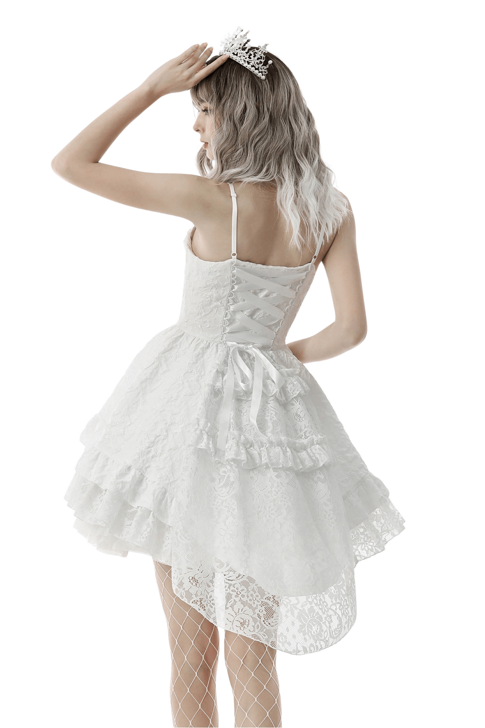 Back view of a gothic hi-low wedding dress with layered lace and a tiara, perfect for a fairy tale look.