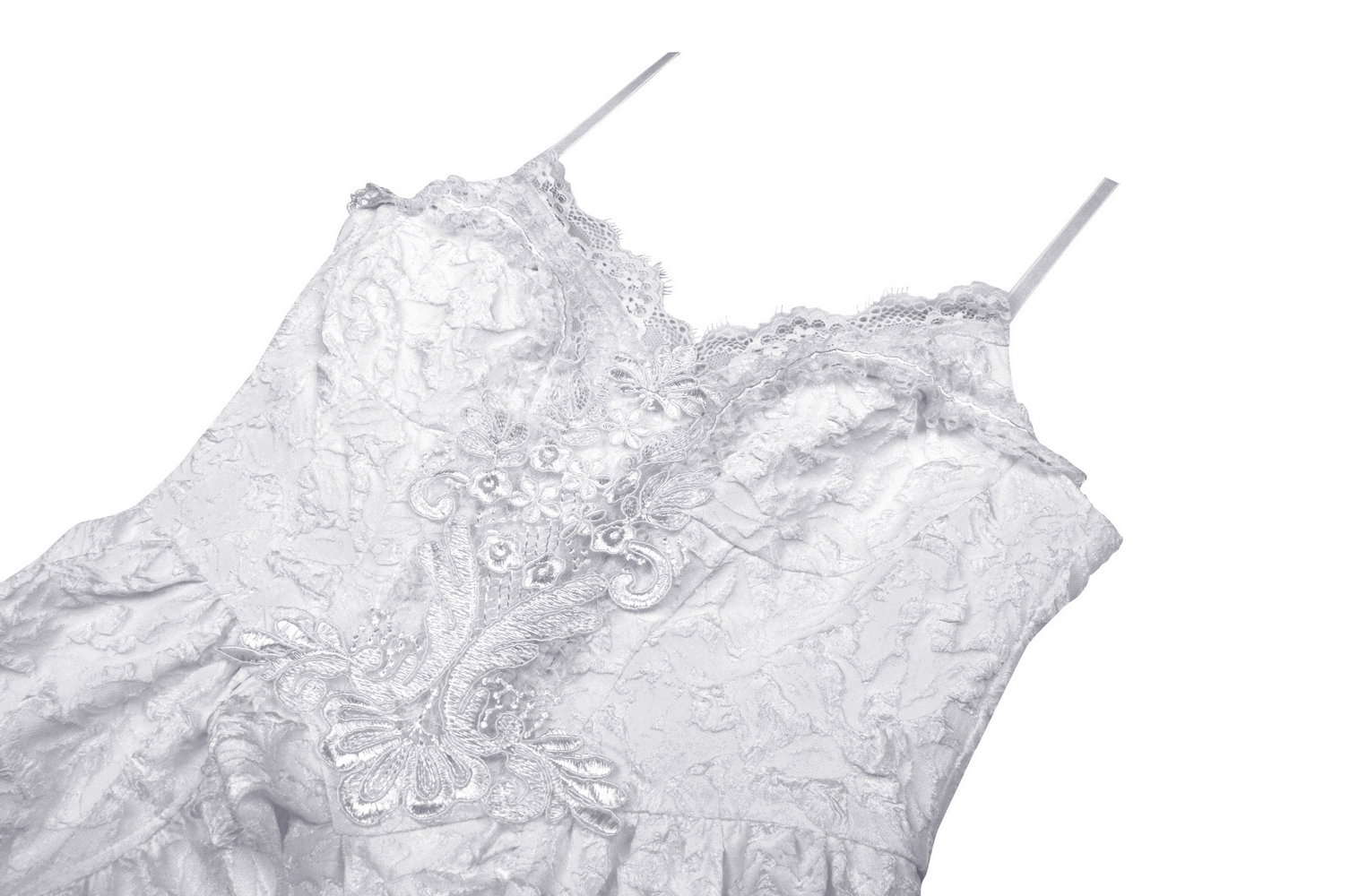 Elegant embroidered white dress with intricate lace details and delicate straps, perfect for a fairytale wedding.