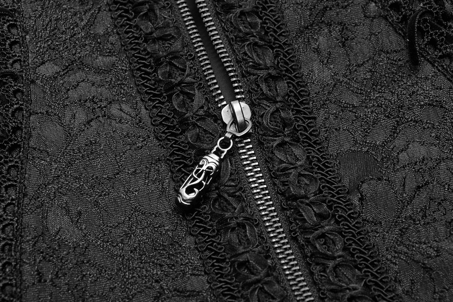 Close-up of gothic jacquard lace waistcoat zipper featuring intricate lace and metal detail for a stylish touch.