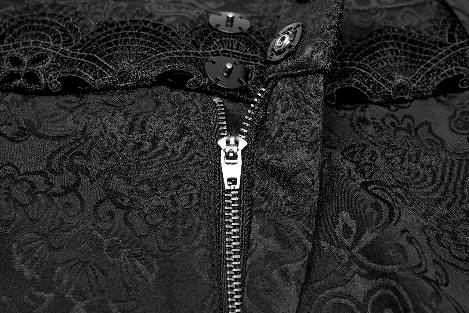 Close-up of Gothic Jacquard Lace Pants showing intricate lace trim and stylish metal accents.