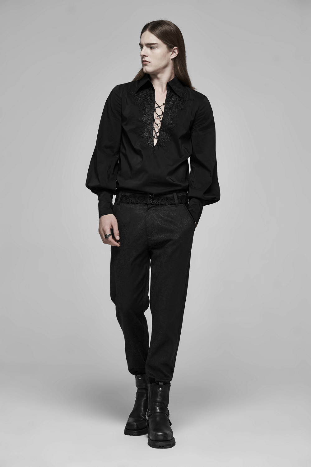 Model wearing Gothic Jacquard Lace Pants and a lace-up black shirt, exuding edgy elegance and Victorian flair.