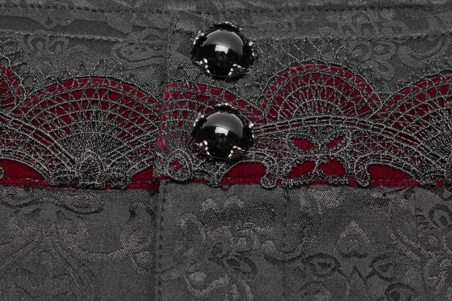 Close-up of Gothic Jacquard Pants showcasing lace detail and ornate metal buttons for a dark romantic style.