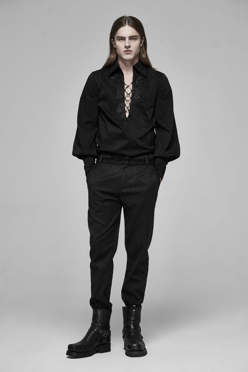 Model wearing black Gothic Jacquard lace pants with metal buttons and an elegant lace-up shirt.