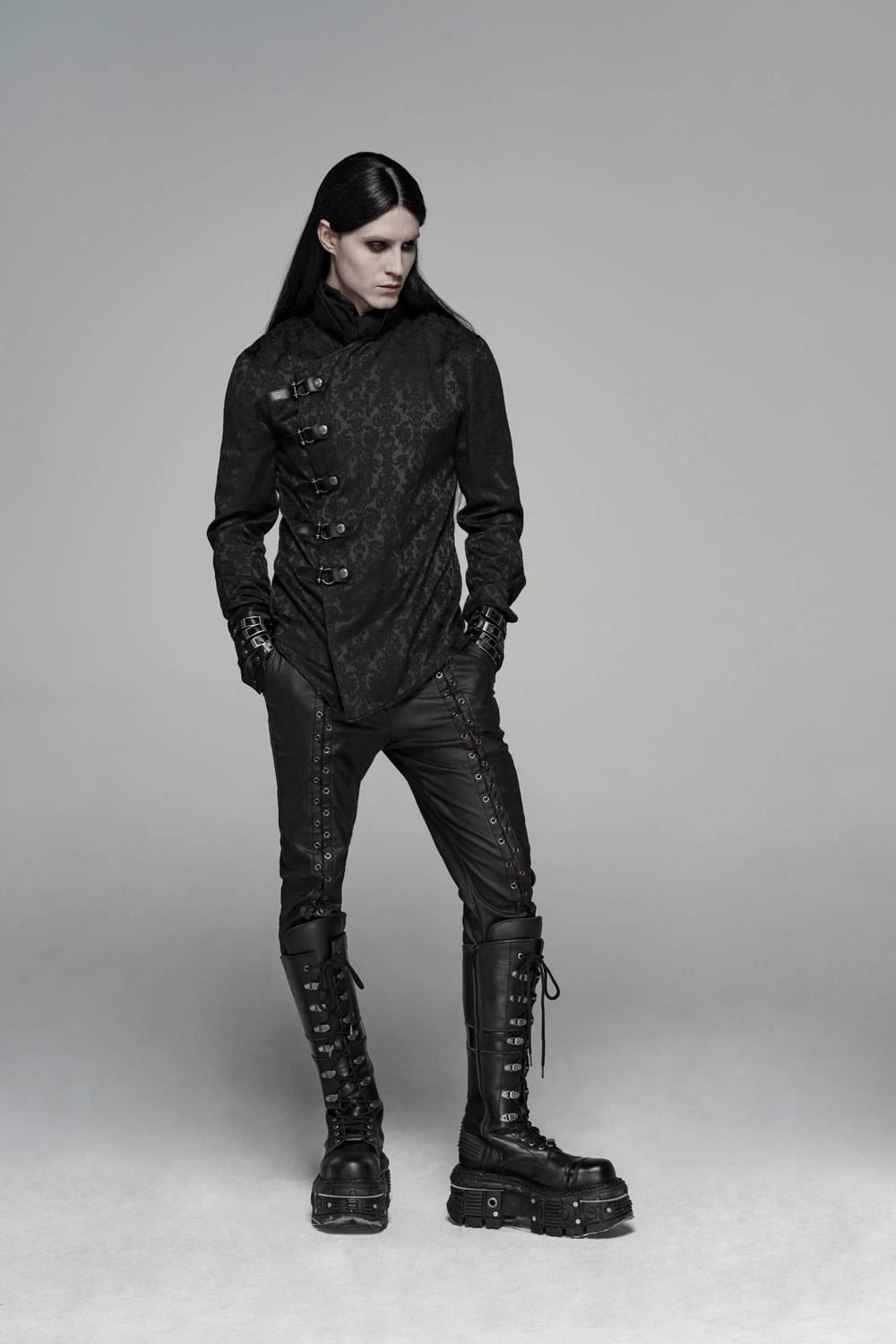 Gothic jacquard slim shirt with leather buckles styled with punk-inspired leather pants and boots.