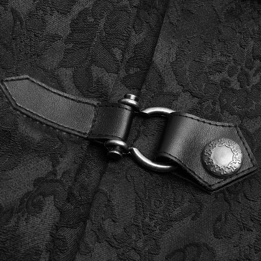 Close-up of punk-style leather buckle on gothic jacquard shirt, featuring intricate patterned fabric.