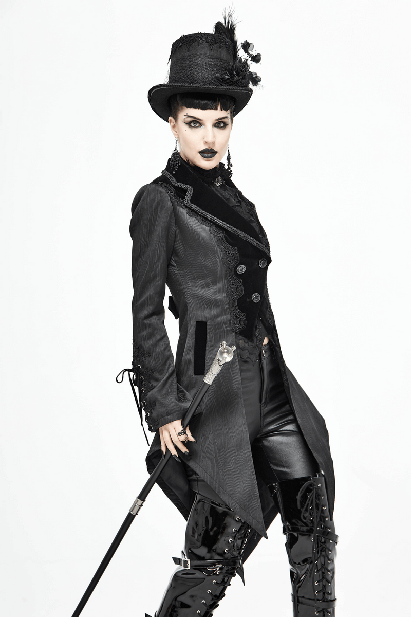Gothic vintage coat model with top hat, lace details, and silver buttons, showcasing elegant gothic fashion.