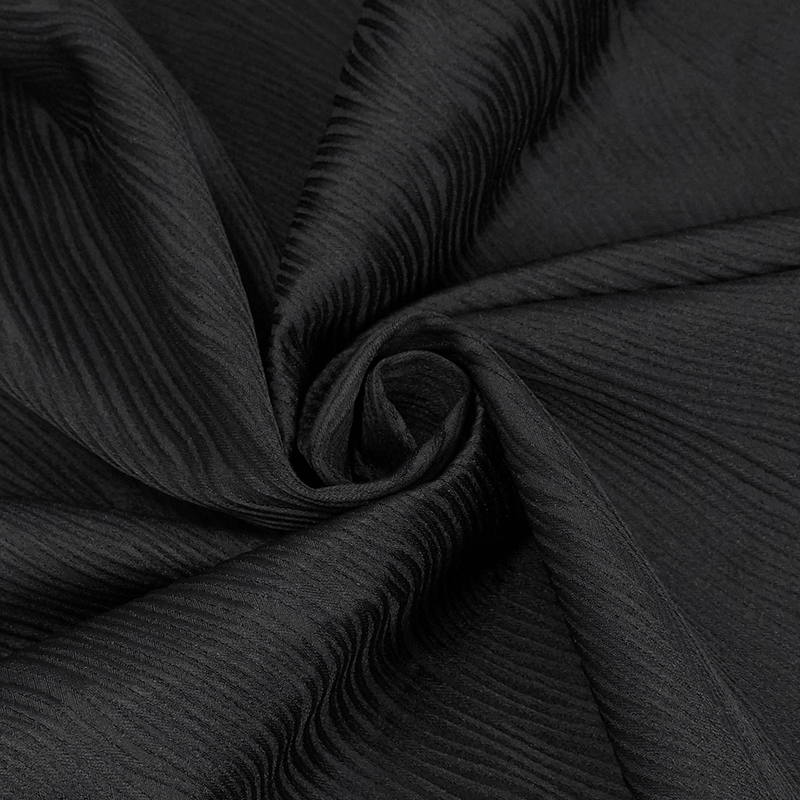 Elegant black fabric with textured waves perfect for vintage gothic fashion, enhancing the style of any coat.