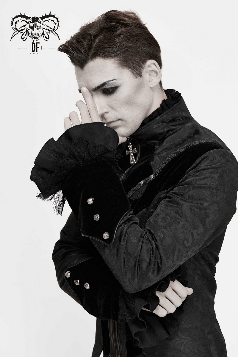 Stylish man in gothic jacquard velvet coat, showcasing vintage fashion and elegance with a striking silver cross detail.