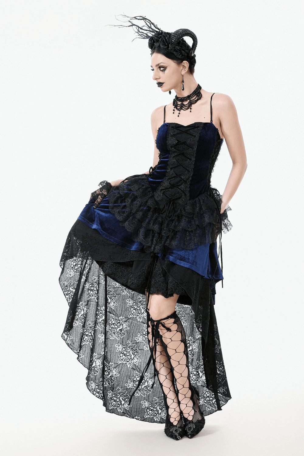 Elegant gothic lace and chain corset dress with ruffled skirt, showcasing a striking silhouette and edgy design.