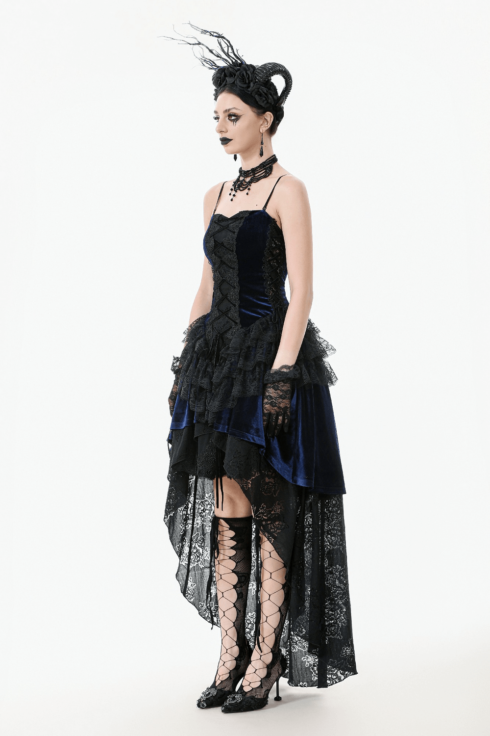Elegant Gothic lace and chain corset dress with ruffled skirt and striking silhouette.