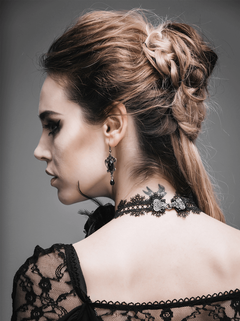Model showcasing a gothic lace and rose neck band choker, emphasizing vintage black fashion accessories.