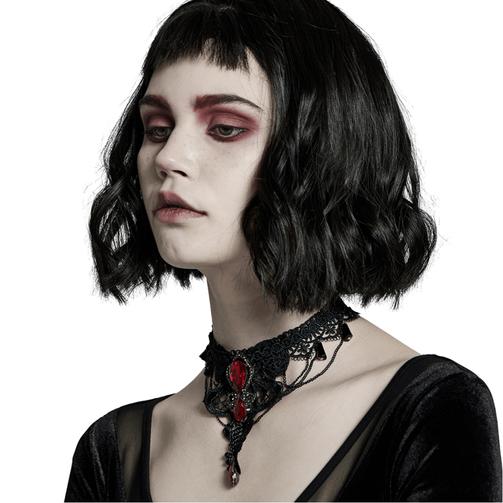 Gothic lace pendant necklace with ruby accents worn by a model, highlighting elegance and unique goth style.