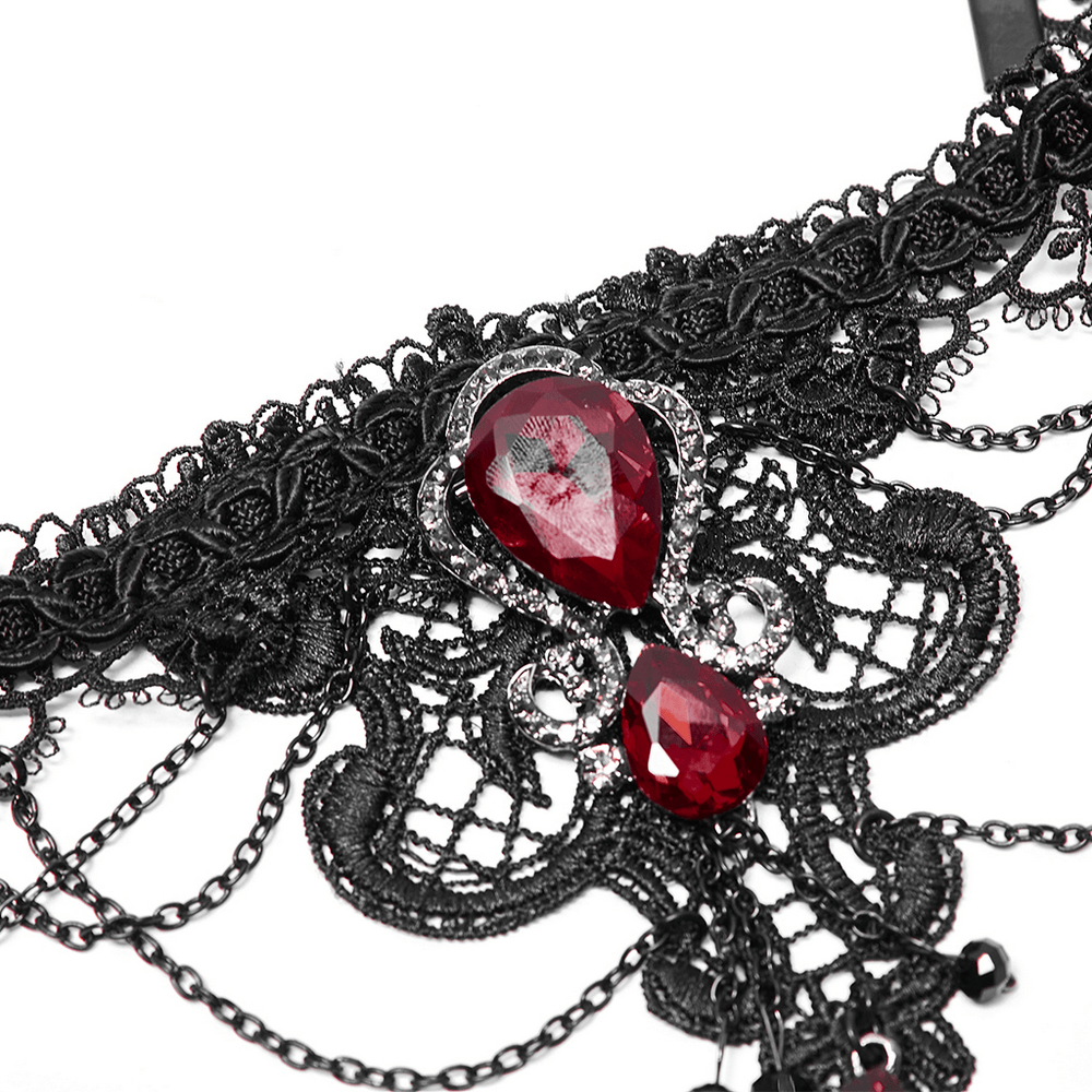 Gothic lace necklace with ruby pendant, featuring intricate details and adjustable chain for unique style.