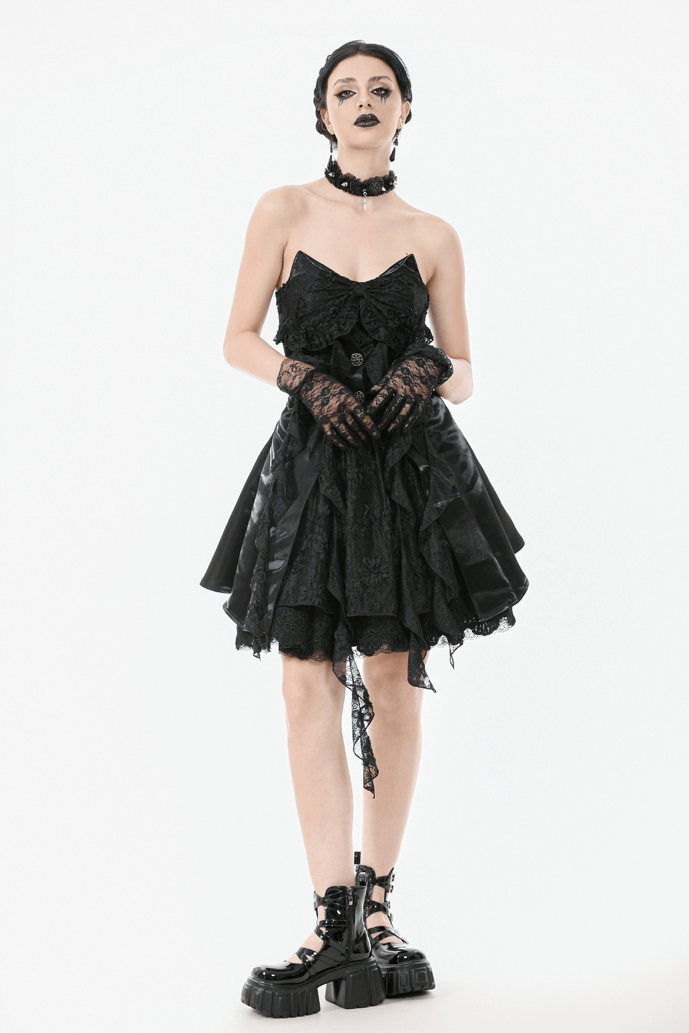Gothic Lace and Satin Corset Mini Dress with Ruffle Details showcased by model, featuring ruffled layers and lace-up accents.