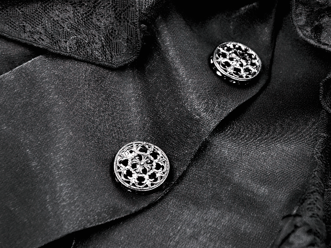 Gothic Lace and Satin Corset Mini Dress with Ruffle Details showing intricate lace and satin fabric with ornate buttons.