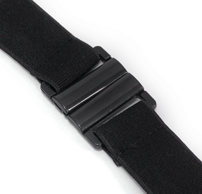 Close-up of a black elastic strap with a sleek buckle detail for secure fit and stylish design.
