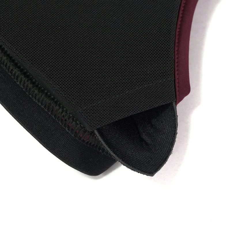 Close-up of gothic lace appliqued swimsuit set in elegant burgundy and black, featuring quality mesh detailing.