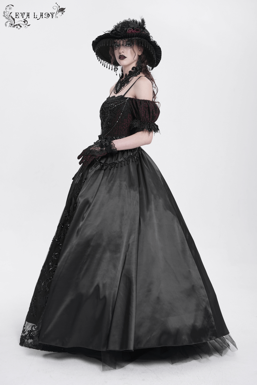 Gothic lace-back maxi dress with chain detail, lacing, and elegant black satin skirt, perfect for dramatic evenings.