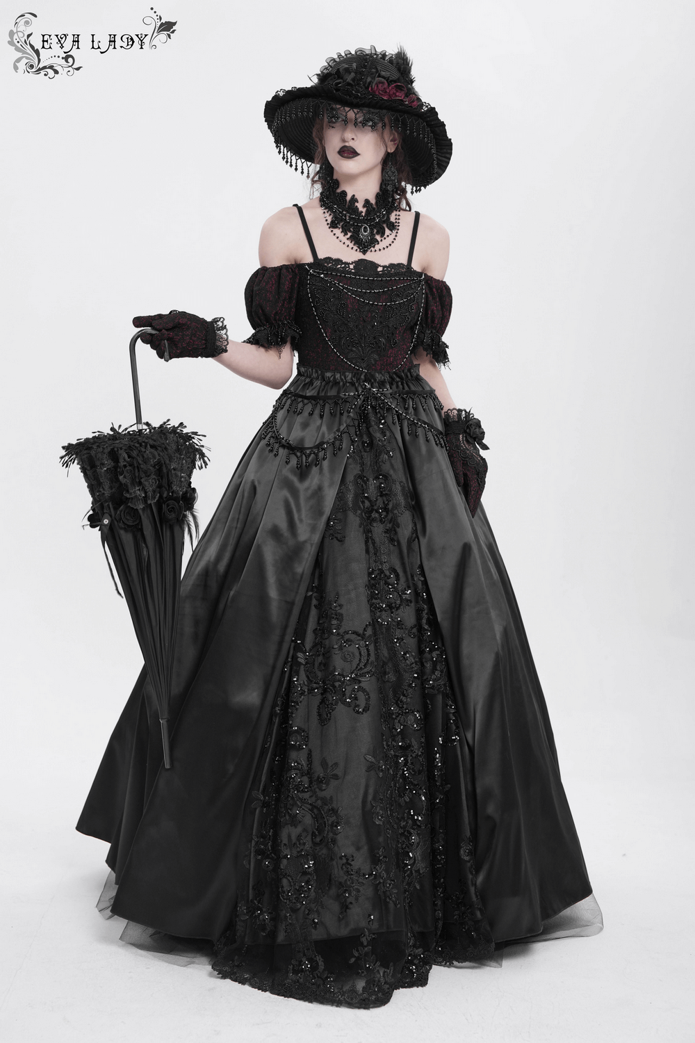 Gothic lace-back maxi dress with chain detail, featuring elegant black satin and intricate lace accents.