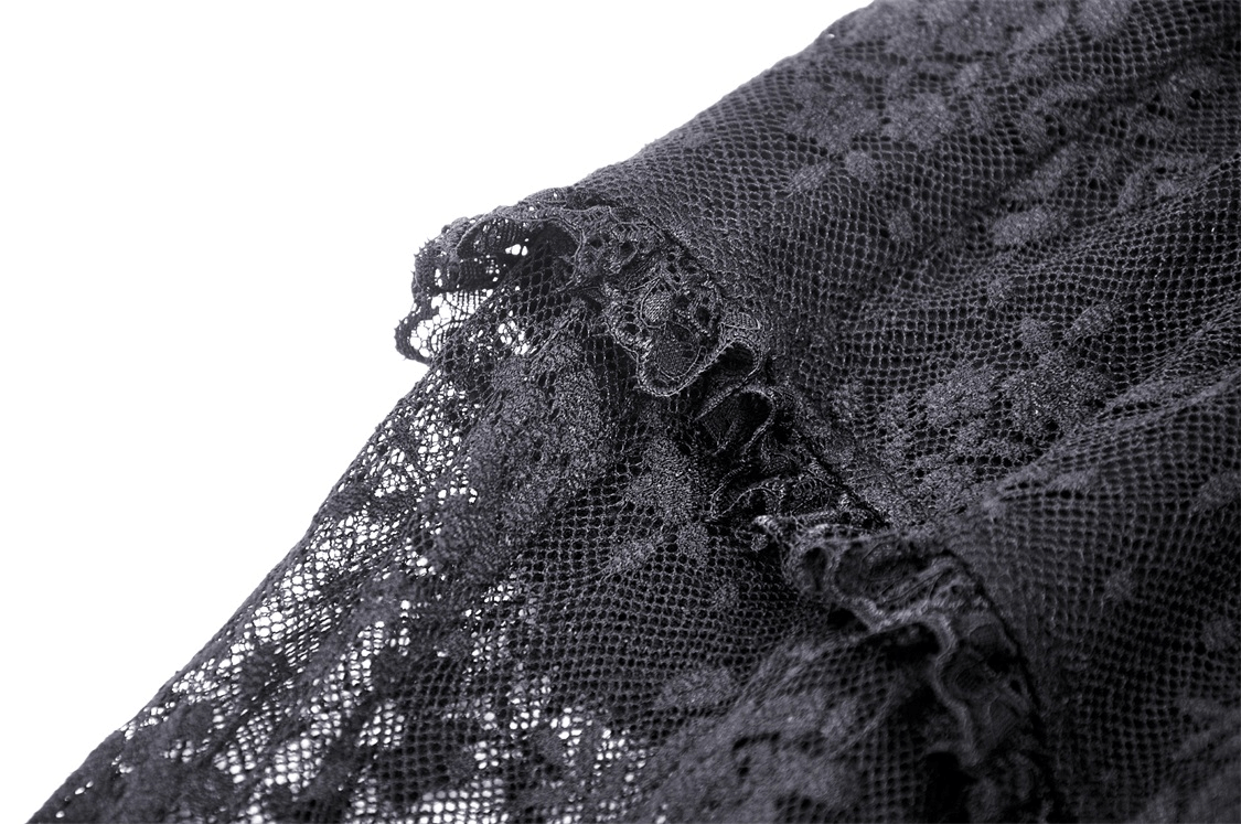 Close-up of elegant black lace detailing from Gothic Lace Bell Bottoms, showcasing intricate textures and sophisticated style.