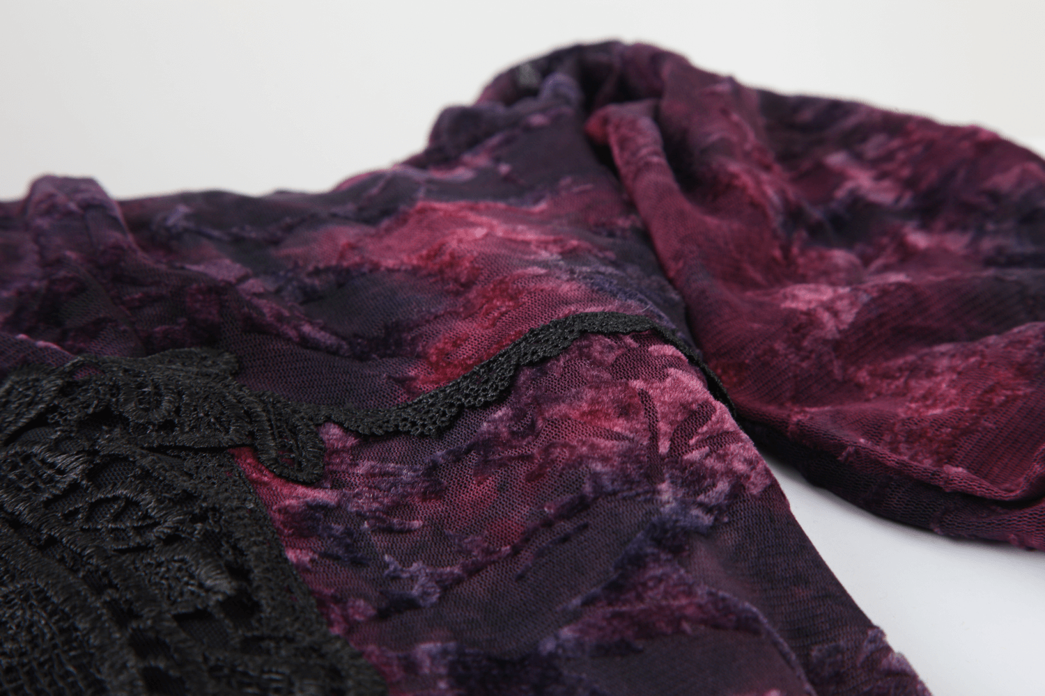 Alt Tag: Gothic Lace Bell Sleeved Maxi Dress and Sheer Mesh Inset close-up of purple floral lace overlay with black embroidery trim