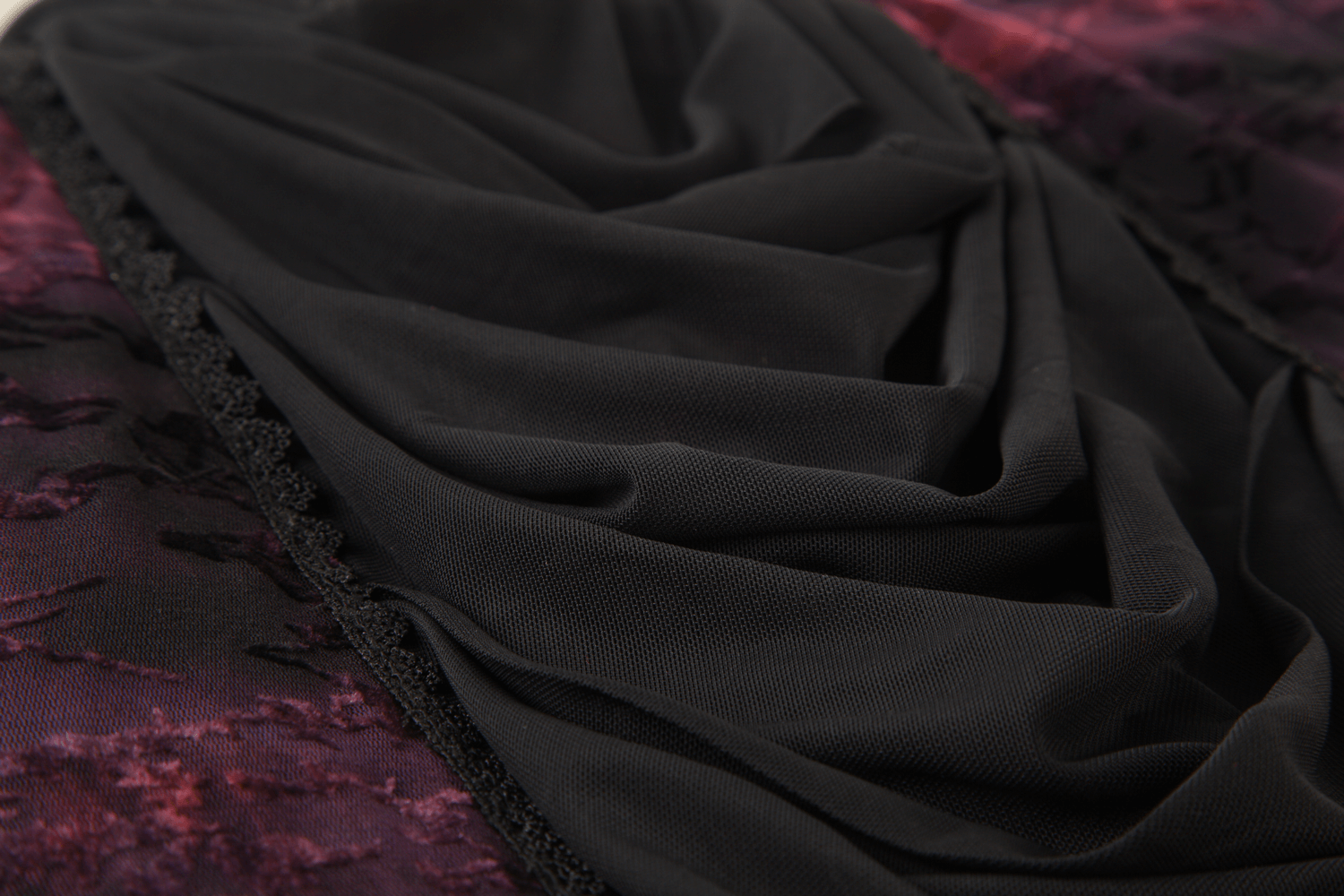 Alt Tag: Gothic Lace Bell Sleeved Maxi Dress and Sheer Mesh Inset close-up of draped black mesh and purple floral lace embroidery