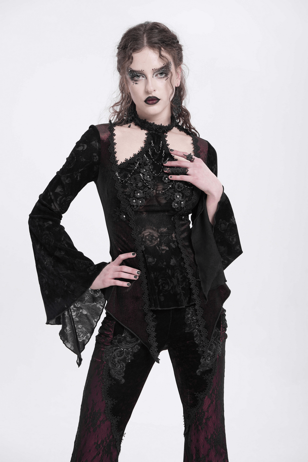 Gothic lace bell-sleeved top with rose embellishments, ideal for alternative fashion and dark romantic looks.