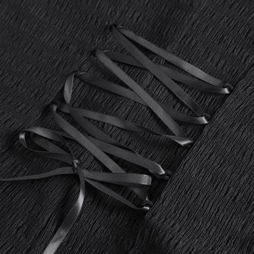 Close-up of black lace blouse with elegant ribbon lacing detail, showcasing gothic and Victorian-inspired style.