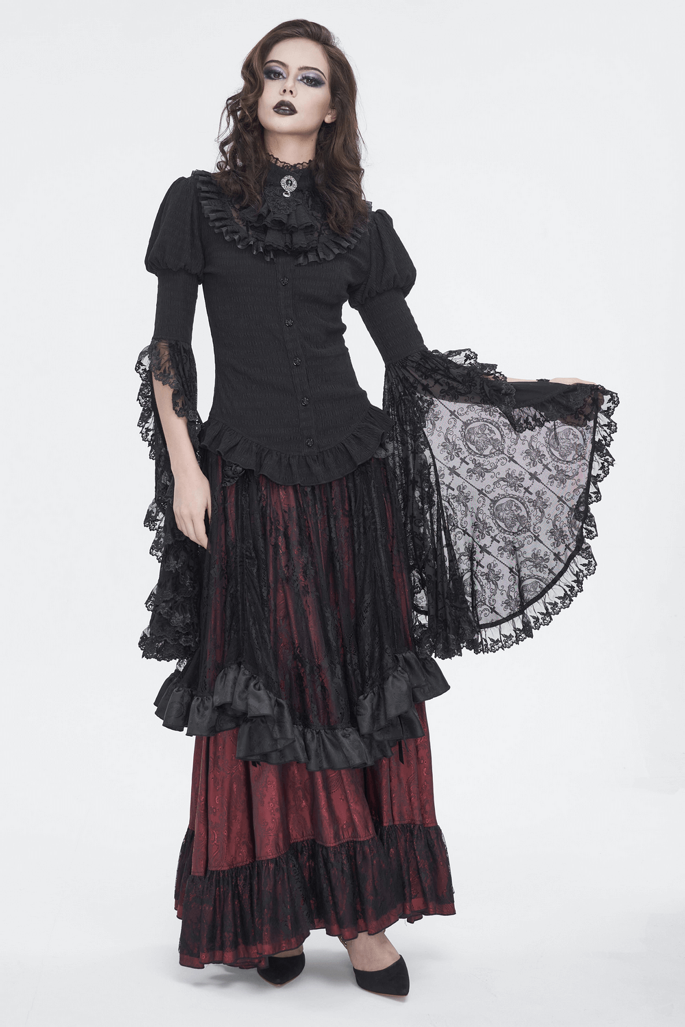 Gothic lace blouse with ruffled neck and flare sleeves, paired with a dark layered skirt, embodying Victorian elegance.
