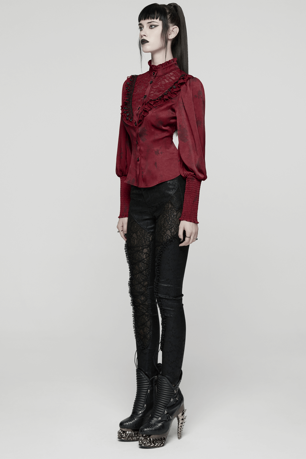 Gothic Lace Blouse with Ruffles and Rose Buttons worn with stylish high-heeled boots, showcasing a dark gothic look.
