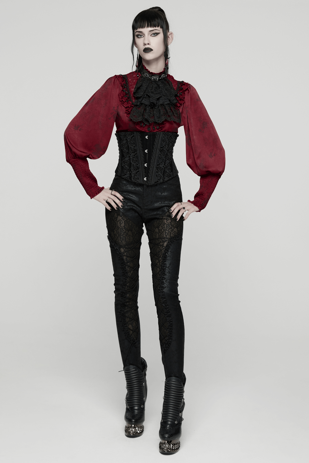 Gothic Lace Blouse with Ruffles and Rose Buttons worn with stylish pants and heels in a minimalist setting.