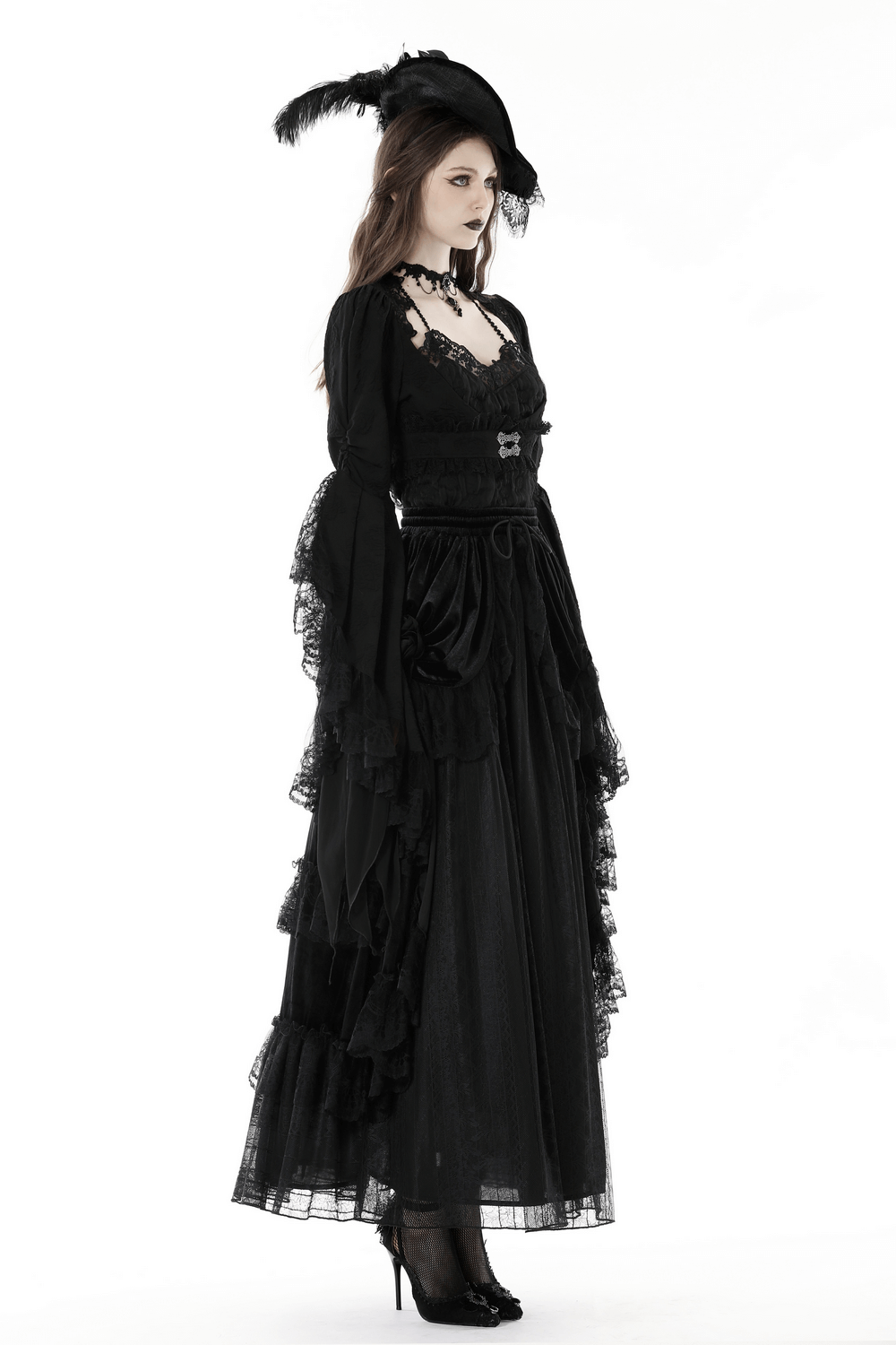 Gothic lace bolero with long bell sleeves, paired with a dramatic floor-length black dress and stylish heels.