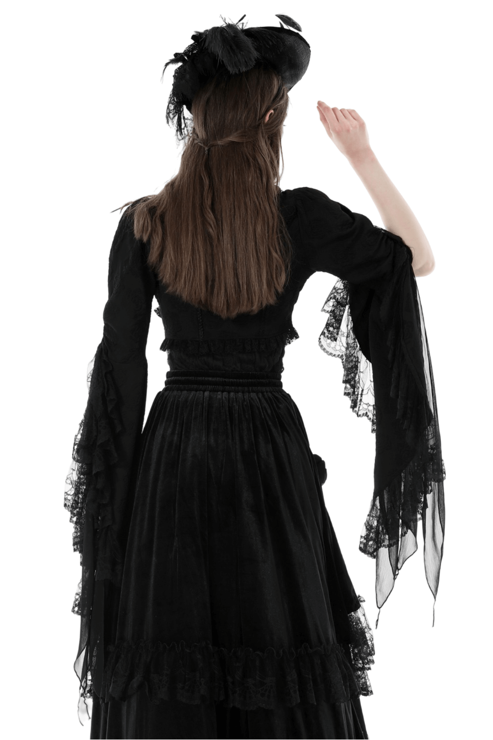 Model showcasing the back of a gothic lace bolero with long bell sleeves and an elegant hat.