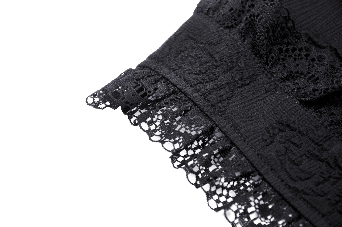 Close-up of intricate black lace detail on gothic bolero, showcasing elegant texture and design.