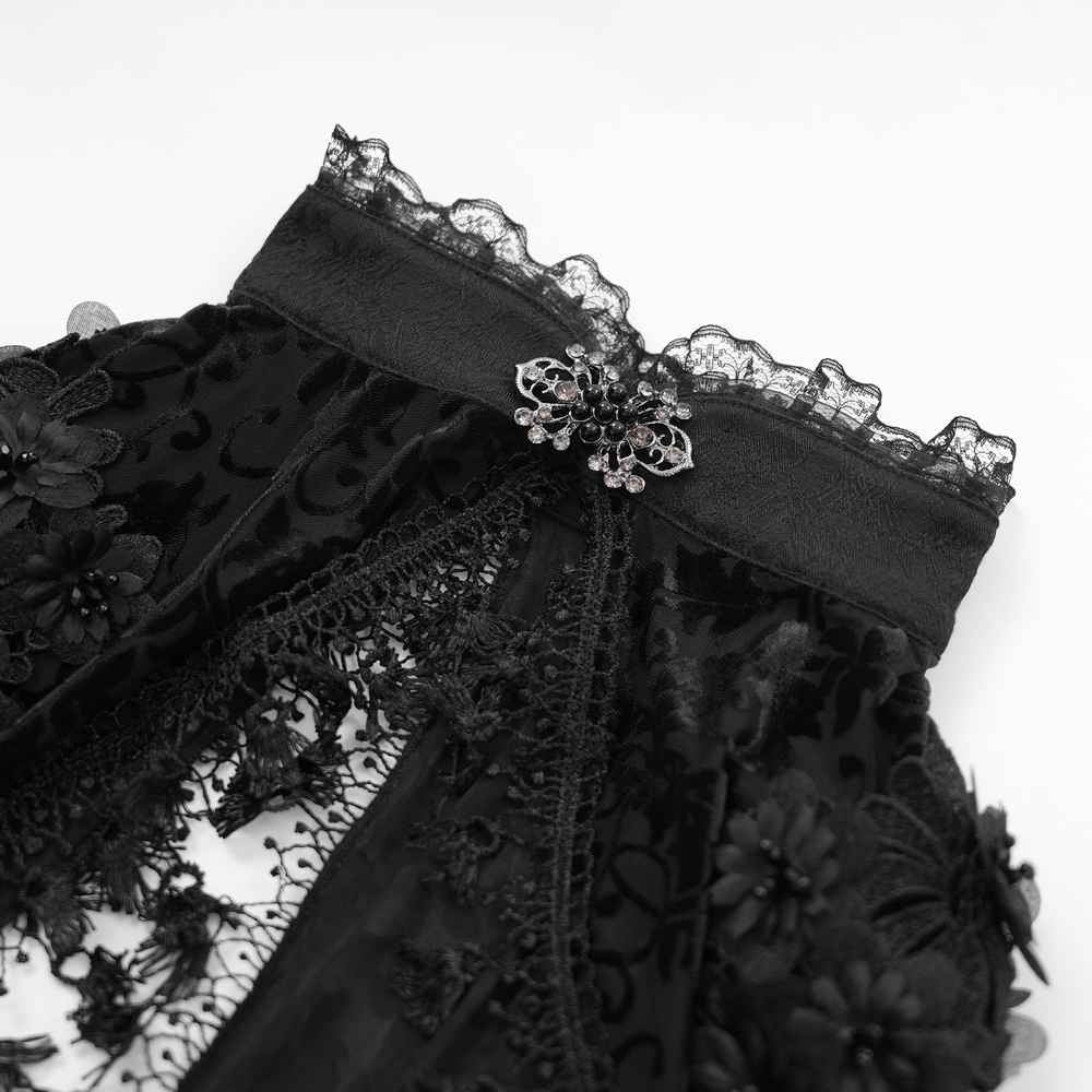 Elegant black lace bolero featuring intricate floral details and a stunning embellishment, perfect for gothic attire.