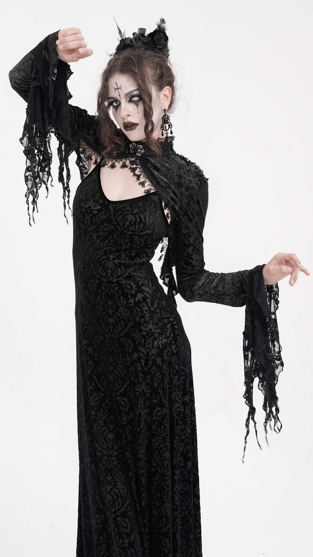 Model showcasing a Gothic lace bolero with dramatic bell sleeves, embodying a Victorian-inspired gothic style.