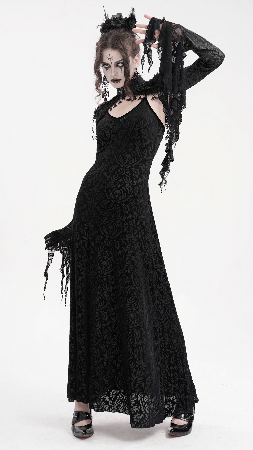 Gothic woman in a dramatic black lace dress with intricate details and bell sleeves, perfect for dark elegance.