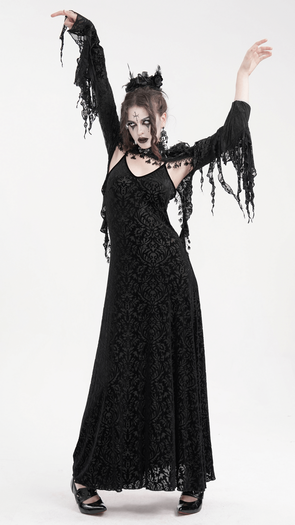 Elegant model wearing a Gothic lace bolero with dramatic bell sleeves, showcasing a Victorian-inspired black lace dress.