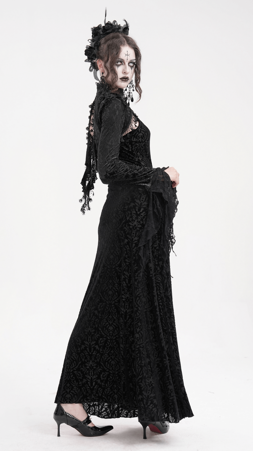 Elegant model in a gothic black lace bolero with dramatic bell sleeves, showcasing Victorian-inspired style and dark allure.