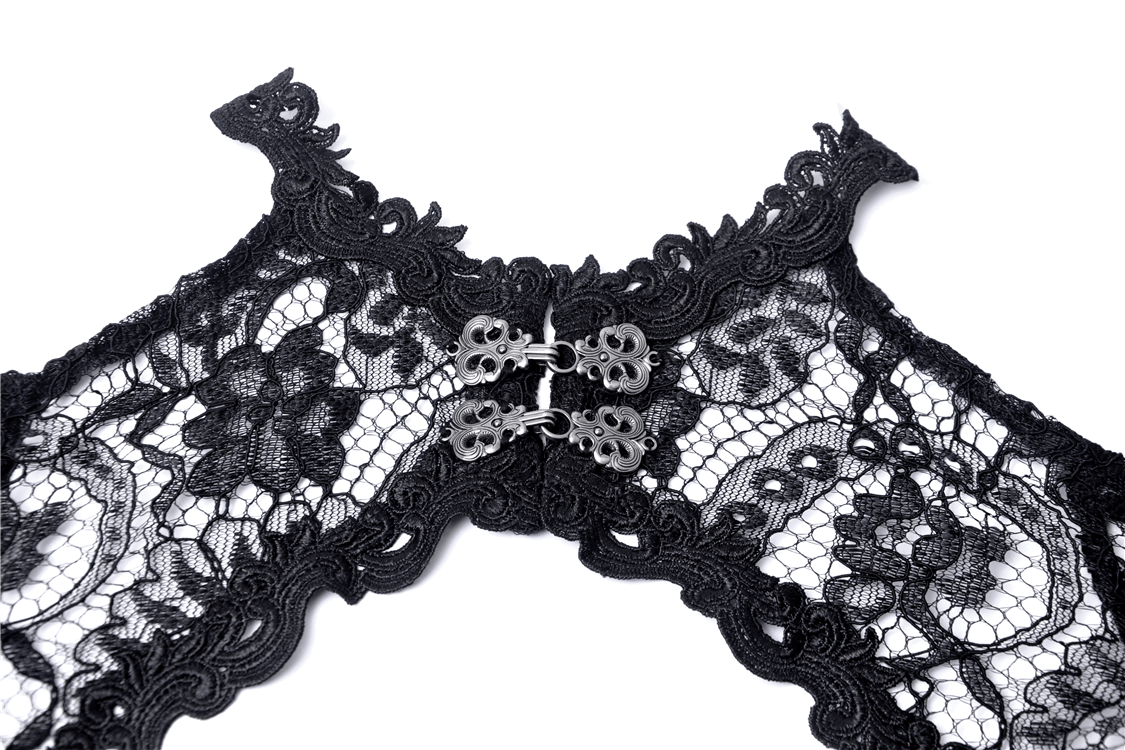 Close-up of a Gothic lace bolero with intricate floral patterns and elegant silver fastenings.