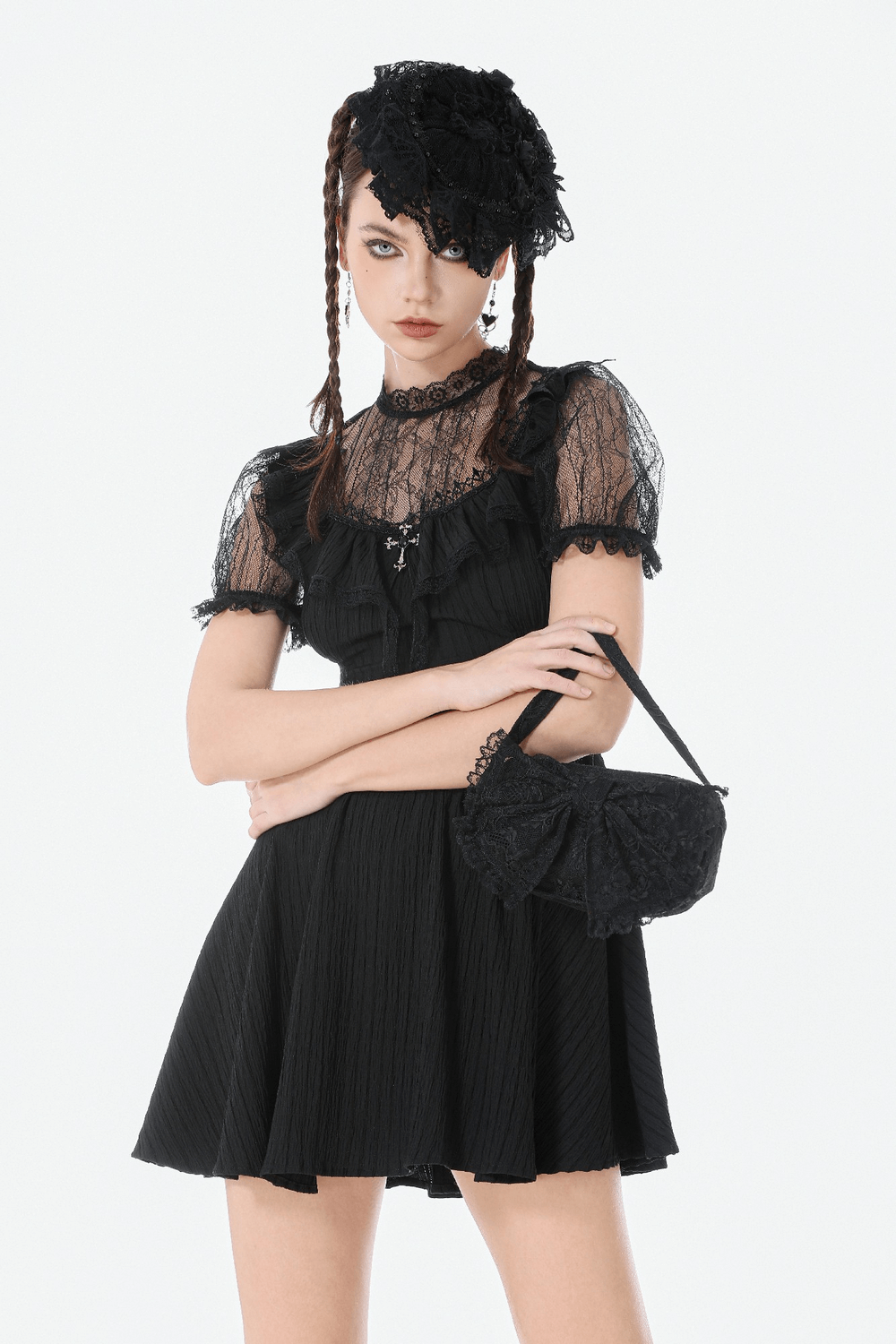 Gothic Lace Bow Mini Handbag with Zipper Closure paired with a black lace dress for a gothic look.