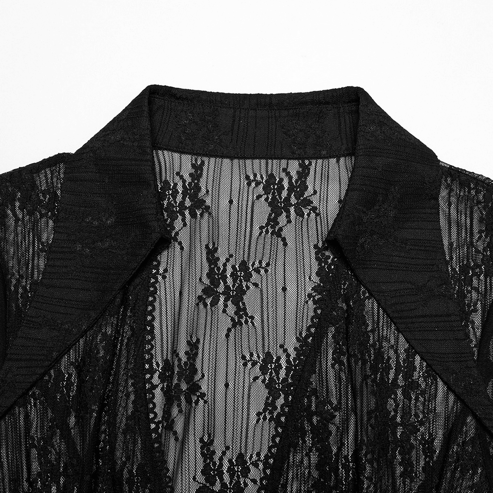 Close-up of a gothic lace cape featuring a drawstring and irregular hem detail in black.