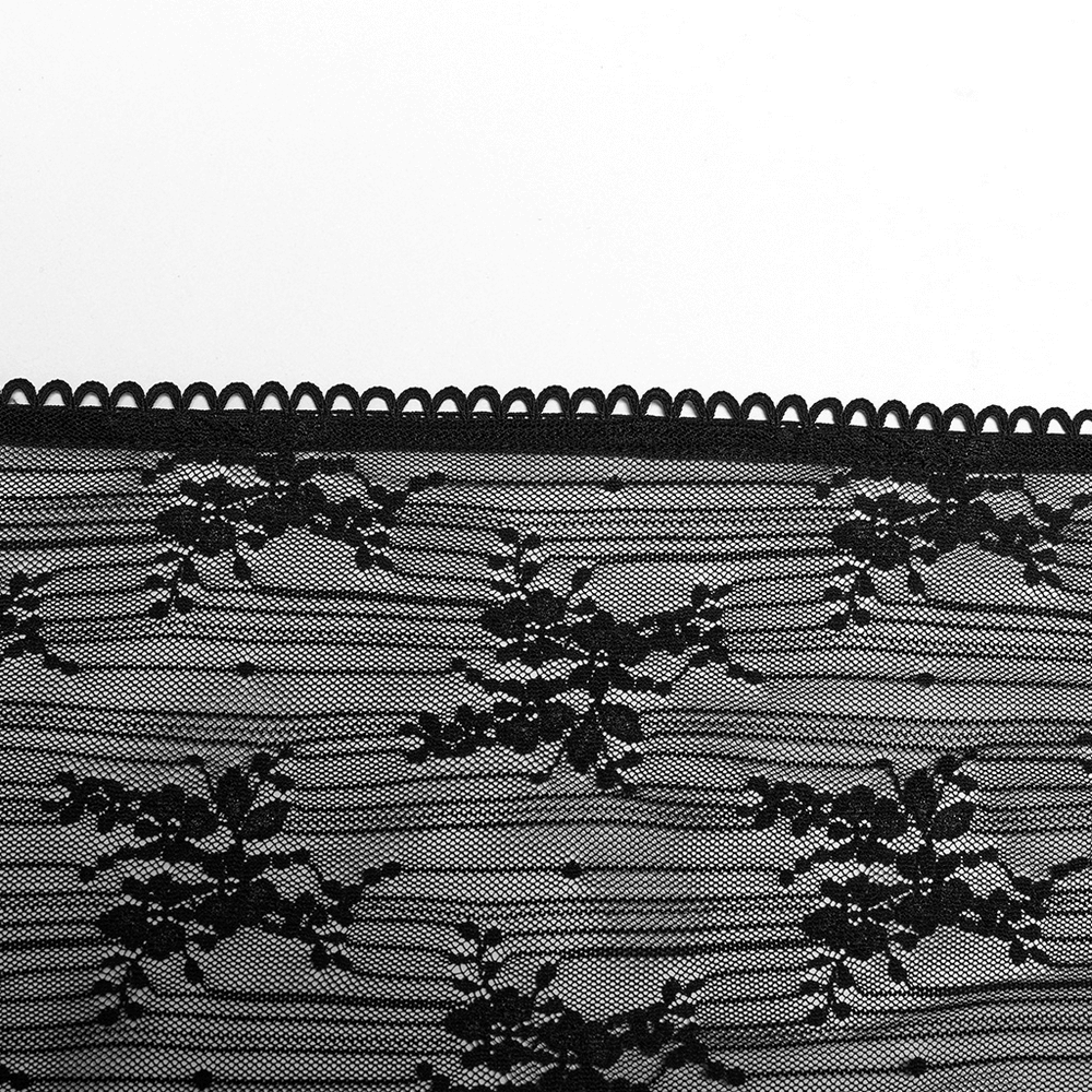 Elegant gothic lace fabric showcasing intricate floral patterns and scalloped edges.